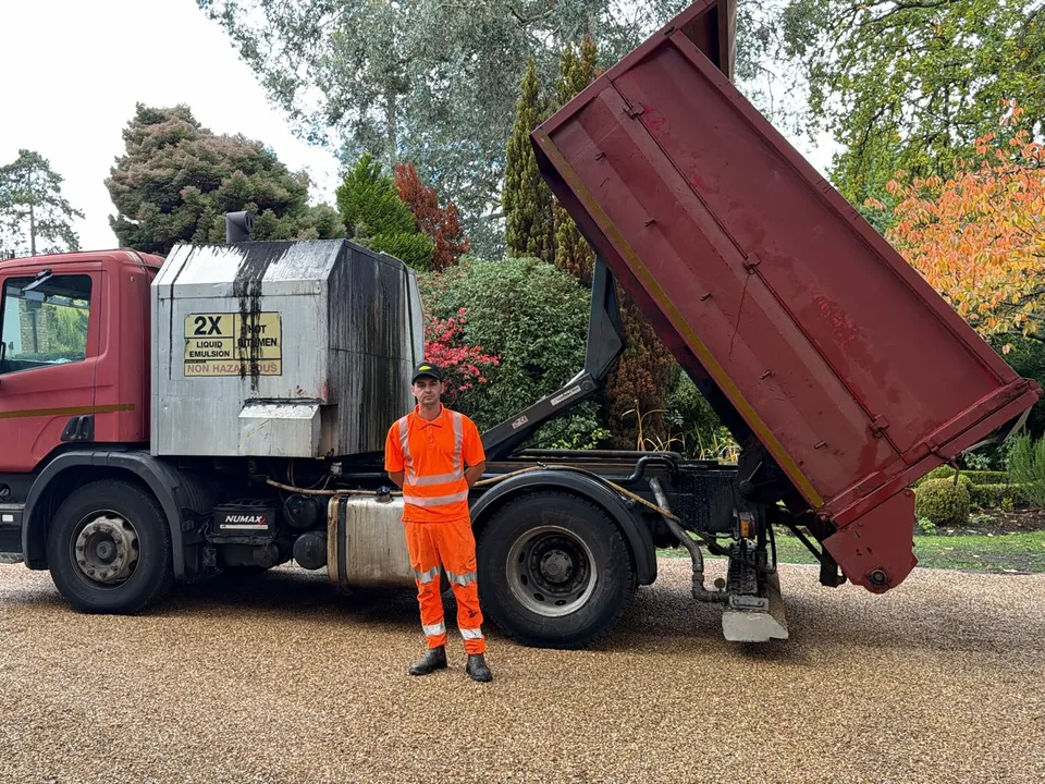 Nelson Smith of Blackstone Surfacing with the surfacing lorry on a finished driveway